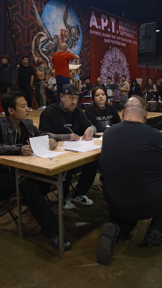 Eugene Serdiuk judging a tattoo convention