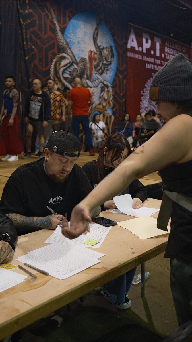 Eugene Serdiuk judging a tattoo convention