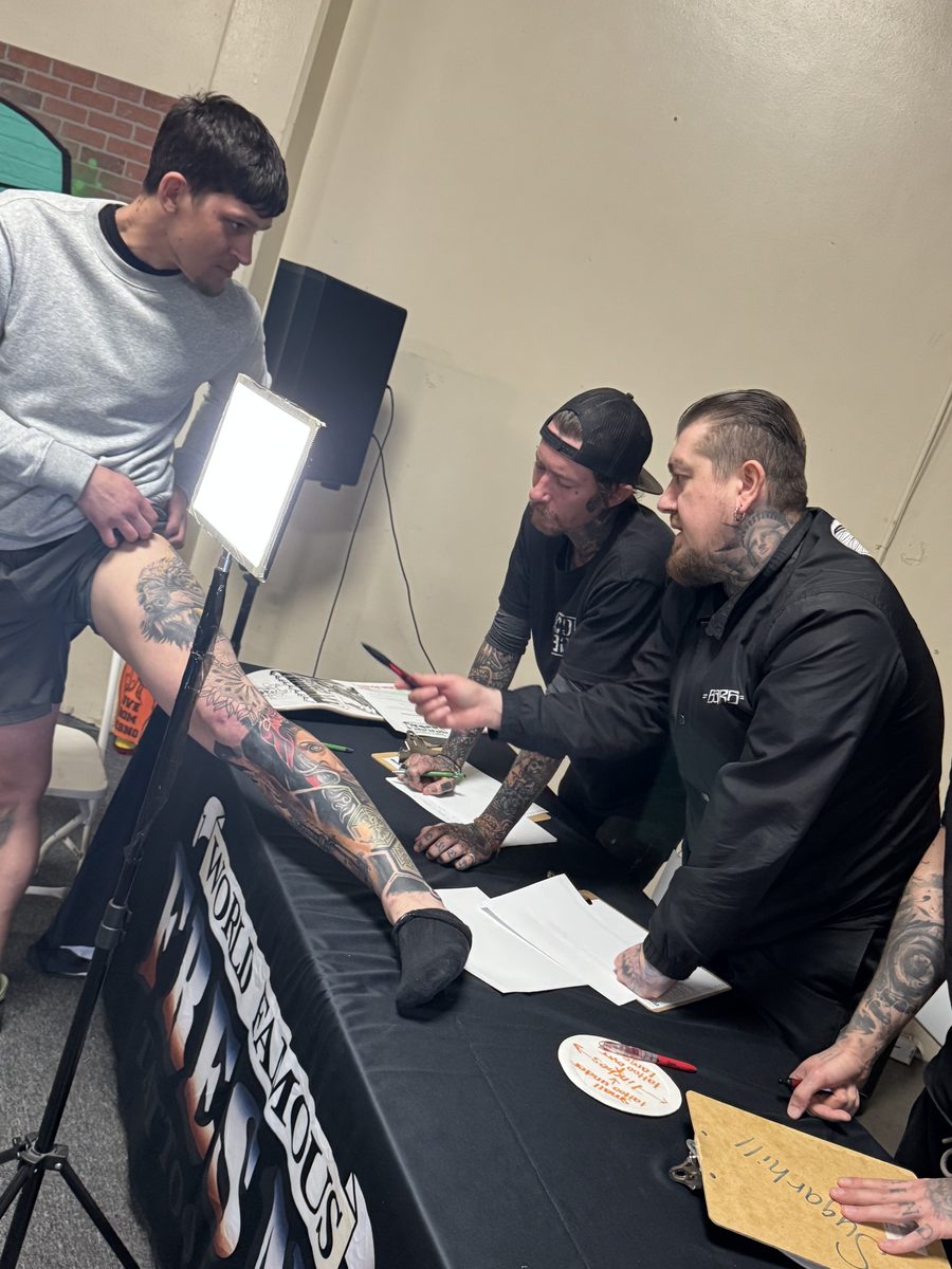 Eugene Serdiuk judging a tattoo convention
