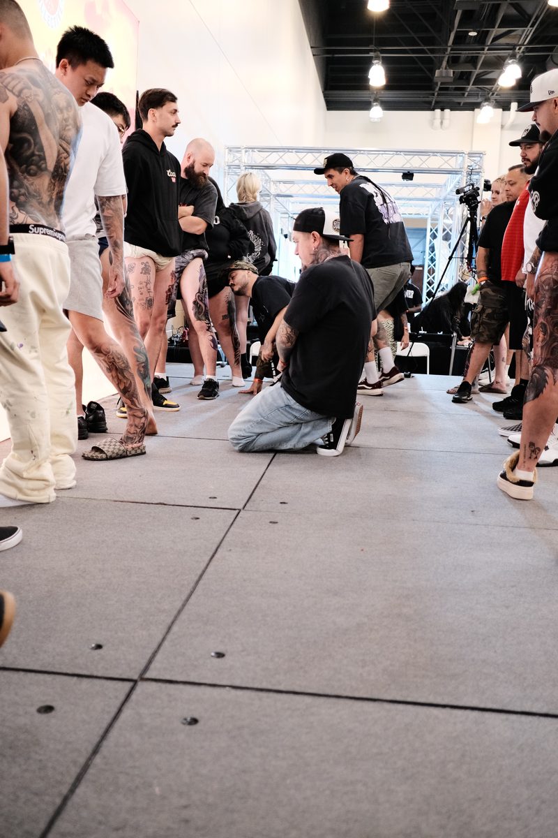 Eugene Serdiuk judging a tattoo convention